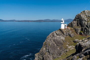 Fototapeta na wymiar view of the historic Sheep's Head Lighthouse on the Muntervary Peninsula in County Cork of Ireland