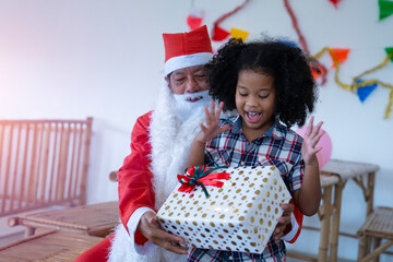 Christmas party, African girl and Santa claus