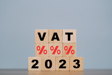 2023 vat concept, paying taxes, 2023, paying vat rates, collecting taxes, vat burden icon on wooden block..