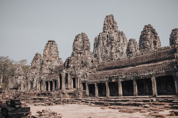 Fototapeta na wymiar Siem Reap, Cambodia - March 18th, 2020 : Ruins of a temple in Angkor Wat archeological complex