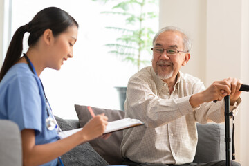 Asian doctor woman visited senior or elderly patient to diagnosis and check up health at home.Happy...