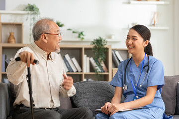 Asian doctor woman visited senior or elderly patient to diagnosis and check up health at home.Happy...