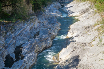 Stormy mountain river in a granite canyon