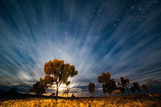 Horizontal shot of a night time lapse on the starry sky and clouds