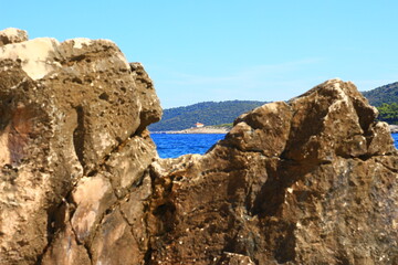 The landscape of the island of Vis, rocky beaches, steep cliffs, lonely islands

