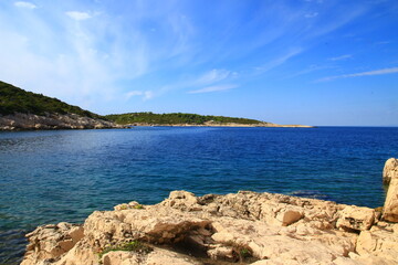 The landscape of the island of Vis, rocky beaches, steep cliffs, lonely islands

