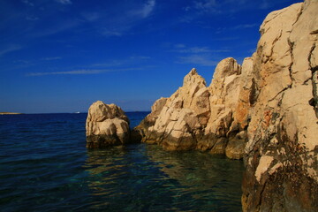 The landscape of the island of Vis, rocky beaches, steep cliffs, lonely islands

