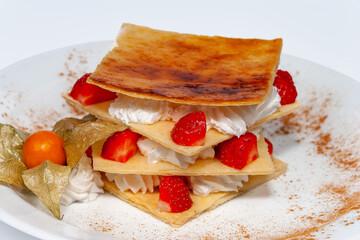 Italian dessert strawberry milfey, made of vanilla cream and fresh strawberries