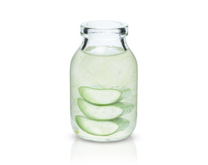 Aloe vera gel with aloevera plant in glass bottle isolated on white background.