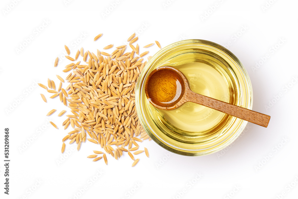 Wall mural rice bran oil with paddy rice isolated on white background, top view, flat lay. - Wall murals
