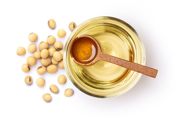 Soybean oil in glass bowl and soy seeds isolated on white background, Top view, Flat lay.