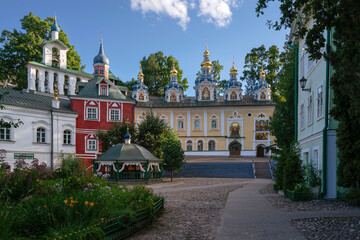 View of the Assumption Cathedral, the Great Belfry and the sacristy in the Holy Dormition Pskov-Pechersk Monastery on a sunny summer day, Pechory, Pskov region, Russia - obrazy, fototapety, plakaty