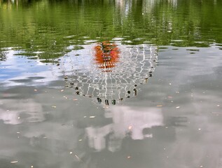 Reflection of a Ferris wheel