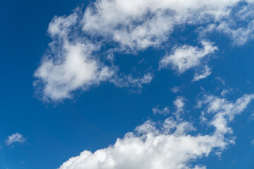 Naklejka na ściany i meble Deep blue sky and white clouds as a texture, pattern, background