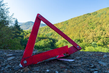 Lightweight versatile carabiner for climbing and mountaineering on a red background