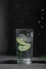 glass of water with lime and ice