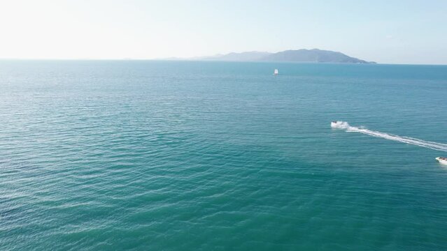 Aerial footage of people on hydrocycles ride in the open water