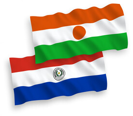 Flags of Republic of the Niger and Paraguay on a white background