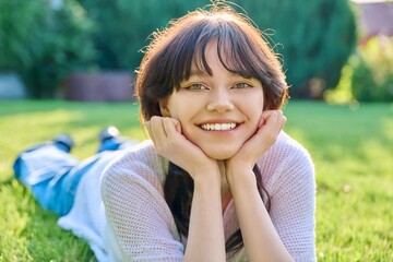Headshot outdoor portrait of young female 18 years old
