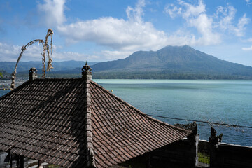 dock on the lake, Batur mountain view, volcano, river, cloud, sunny day, Bali Indonesia, roof...