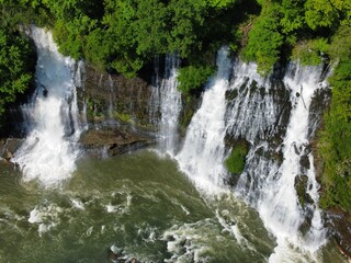 Aerial drone shot of a beautiful waterfall in the forest
