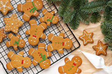 Christmas traditional homemade cookies ginger bread men and ginger stars, the process of decorating...