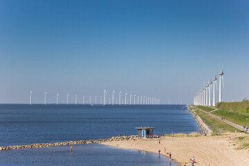 Beach and windturbines at the dike in Urk, Netherlands