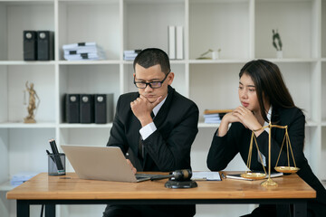 Lawyers sit for a meeting with the team at the law firm.