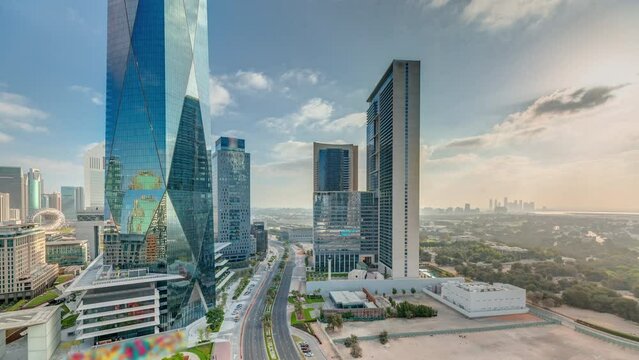 Dubai International Financial district aerial night to day timelapse. Panoramic view of business office towers.