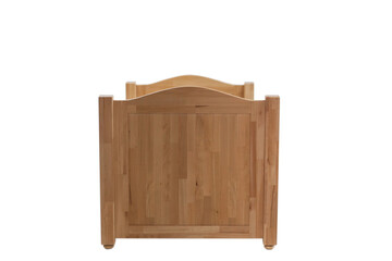 Close-up of a part of a wooden bed for sleeping. Classic sleeping bed furniture made of natural wood.