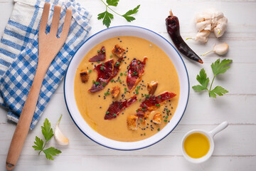 Tomato soup with crispy serrano ham.