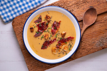 Tomato soup with crispy serrano ham.