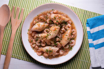 Squid with stewed prawns. Typical tapas of the Spanish coast.