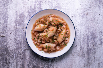 Squid with stewed prawns. Typical tapas of the Spanish coast.