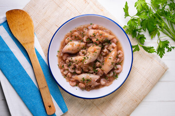 Squid with stewed prawns. Typical tapas of the Spanish coast.