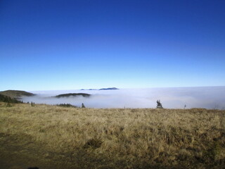 On top of a mountain range, above the clouds