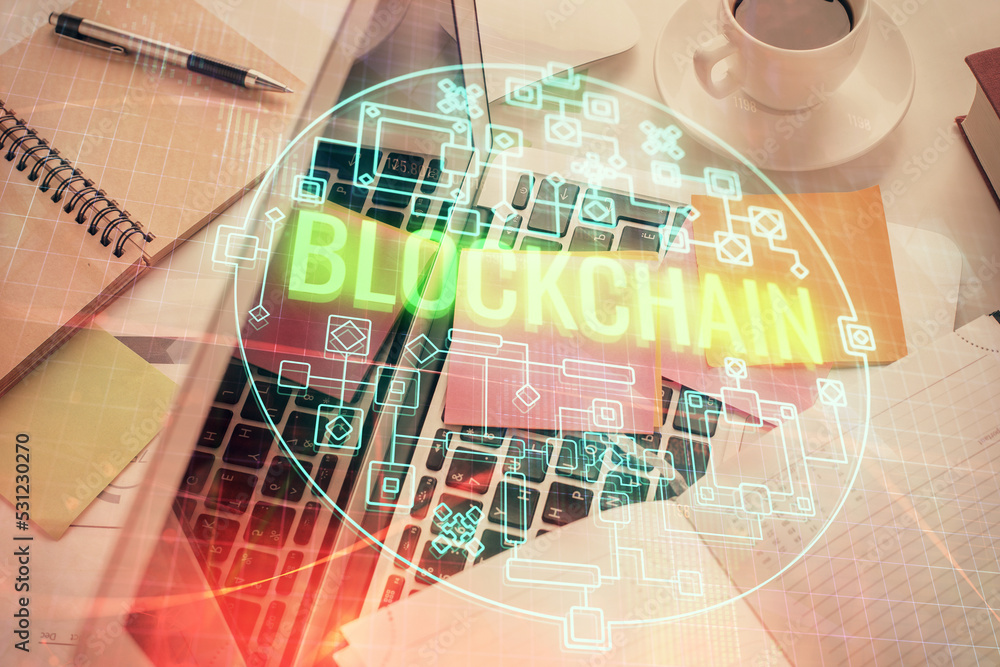Poster blockchain theme hologram drawings over computer on the desktop background. top view. multi exposure