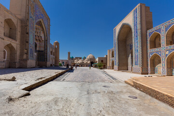 Fototapeta premium Complex of two ancient buildings Ulugbek and Abdulaziz Madrasah facing each other Bukhara Uzbekistan