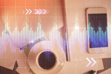 Multi exposure of forex graph hologram over desktop with phone. Top view. Mobile trade platform concept.