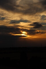 Obraz premium Beautiful sunset with orange and yellow clouds