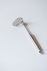 potato crusher chrome plated on isolated white background