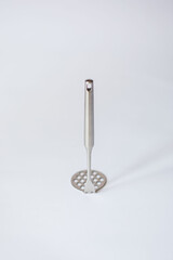potato crusher chrome plated on isolated white background