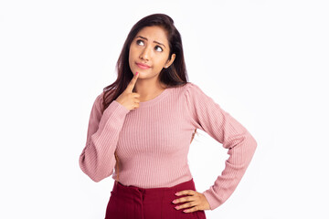 Worried young woman thinking on white background.