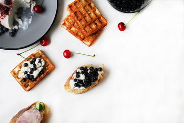 still life top view breakfast of Belgian waffle cheese and berries on a plate. Healthy delicious proper breakfast. Healthy food