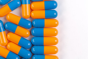 Colorful pill capsule on white background.
