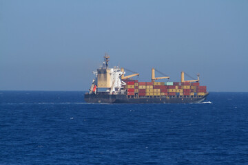 Fototapeta premium A merchant ship underway at sea in calm weather