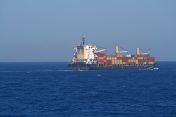 A merchant ship underway at sea in calm weather