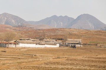 Tractor and farmers in North Korean countryside, between Kaesong and Pyongyang, Democratic Peoples's Republic of Korea (DPRK), North Korea