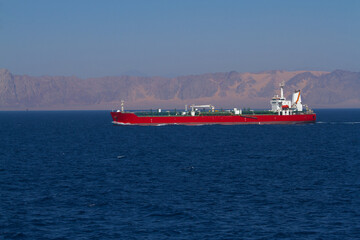 A merchant ship underway at sea in calm weather