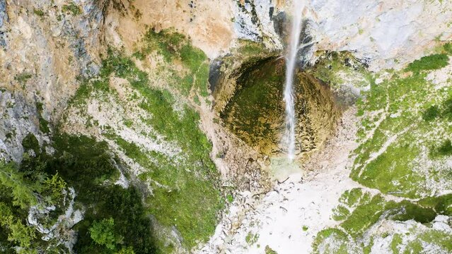 Epic Aerial Shot of Rinka Waterfall, Second Highest Waterfall In Slovenia. Water Slides Down The Abbys on Huge Mossy Rock.